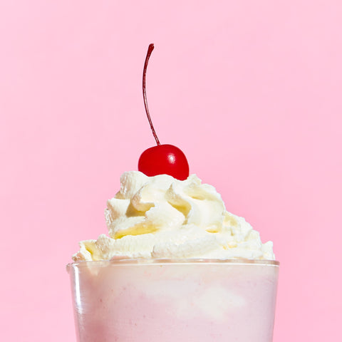 Milkshake topped with fresh whipped cream